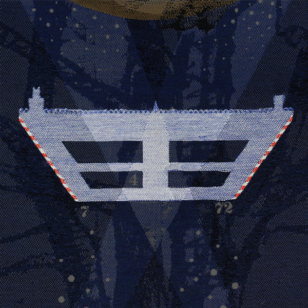 Zoomed section of the The Important Thing Is That You Care tapestry panel which highlights the stylised outline of a house.